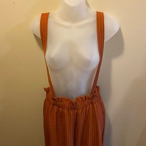 Orange striped suspender pants